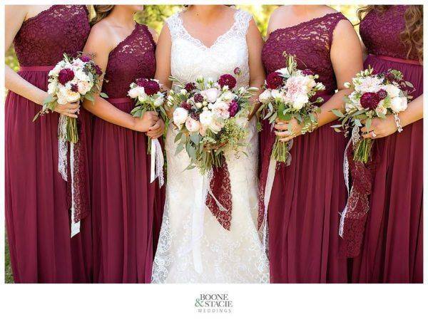 Bride and Bridal party posing with their bouquets